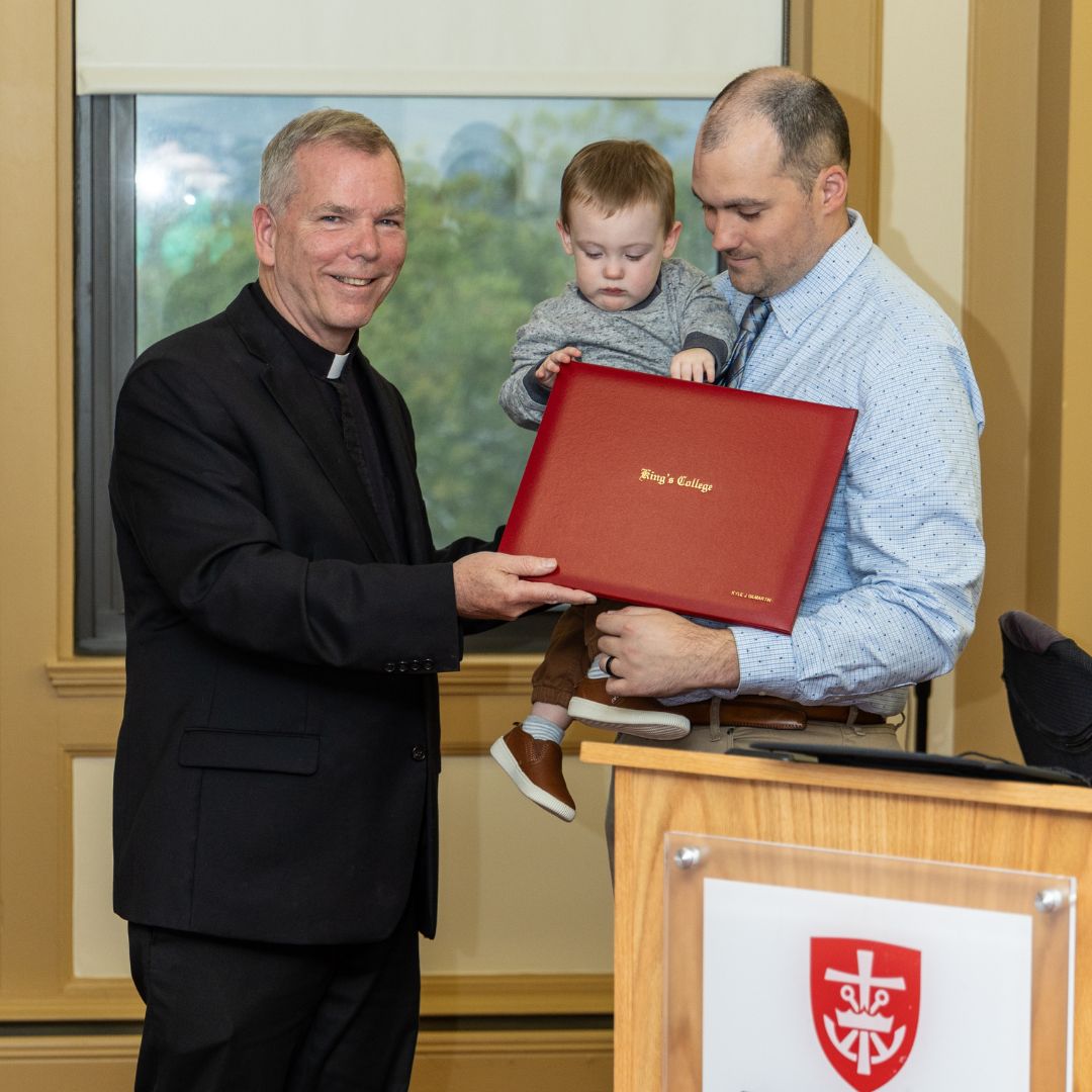 Gilmartin and his son, Liam, receive degree from Fr. Looney