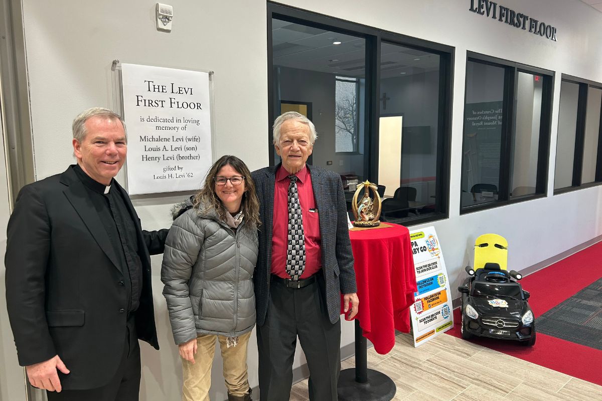 Fr. Looney, Jennifer, and Louis Levi