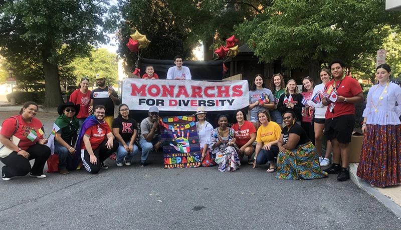 students holding a banner at a diversity event