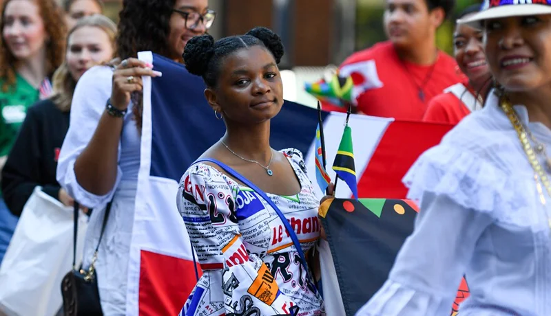 diverse students marching in a parade