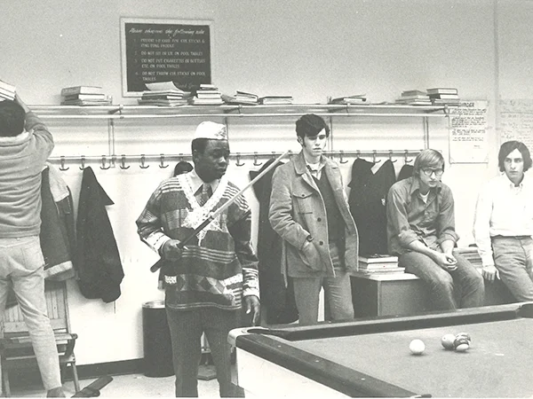 archival photo of Black and White students playing pool