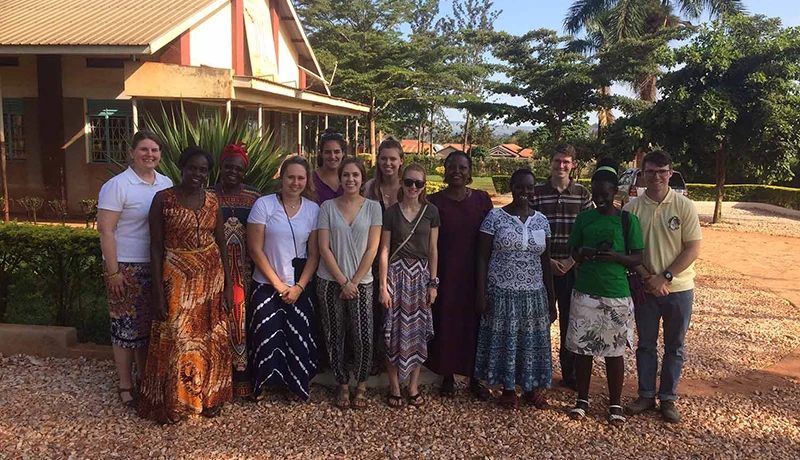 Students and natives posing in Africa