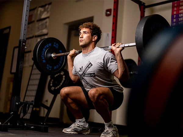 student weight training in the gym