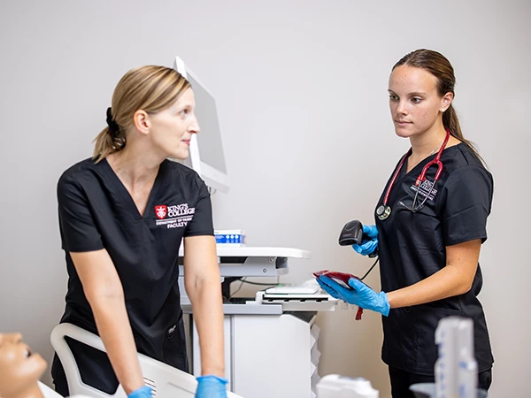 nurses meeting in a hospital hallway