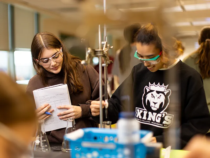 students in safety glasses in a lab