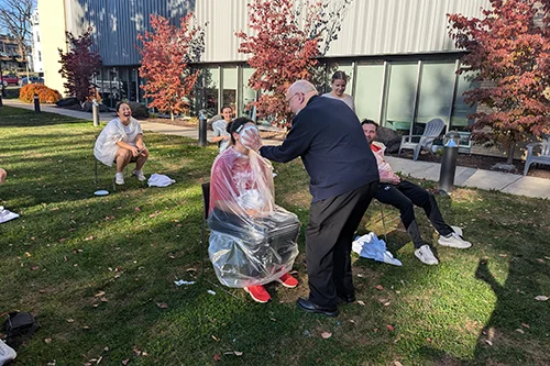 students on campus interacting with clergy