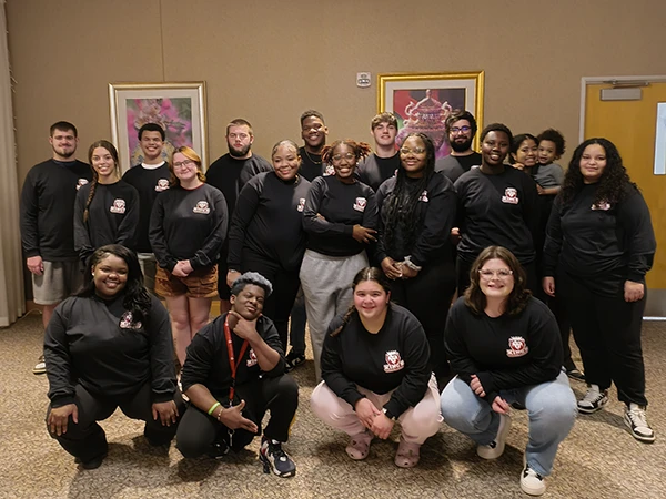 multicultural students posing in the campus center