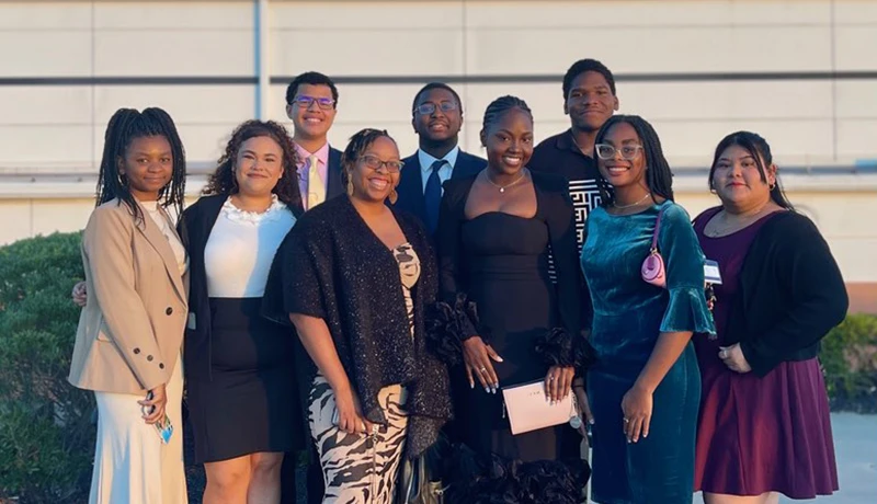 a group of multicultural students posing