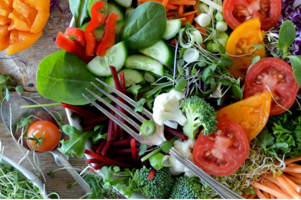 A photo of a mix of fruits and vegetables. 