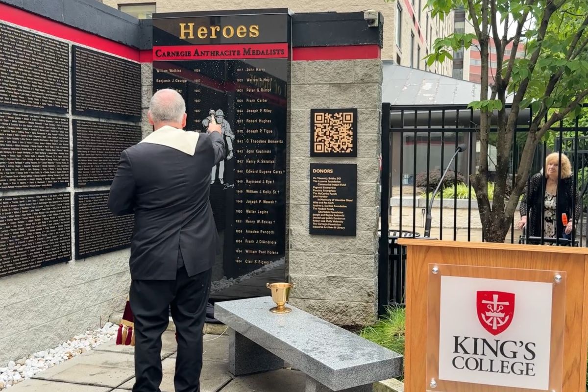 Fr. Looney blessing miner monument