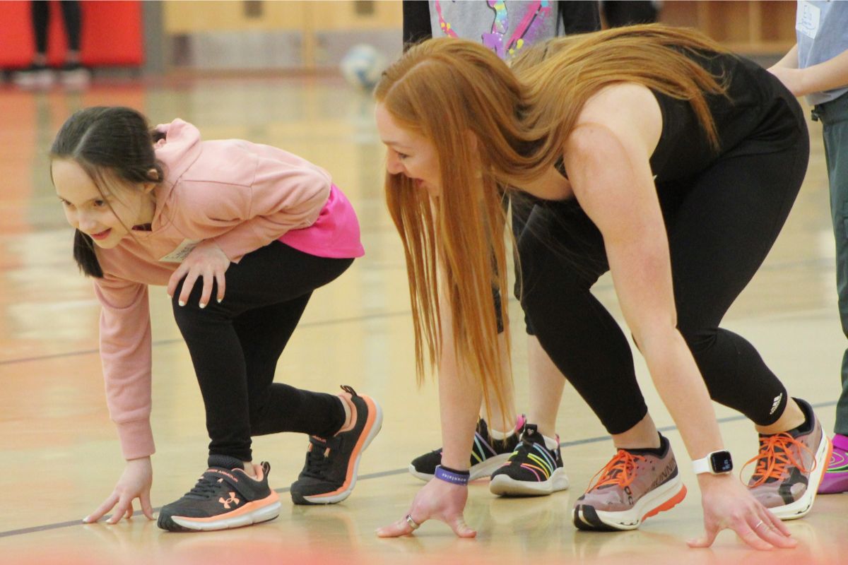 King's athlete and child practicing track